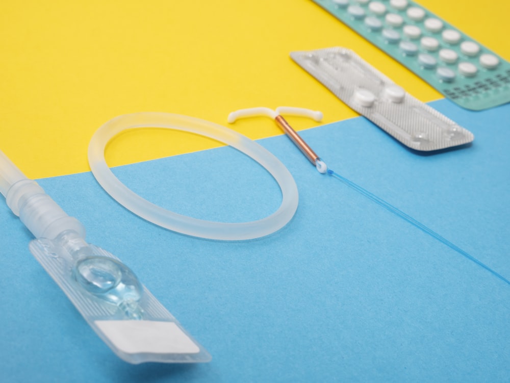 a medical device is laying on a blue and yellow surface