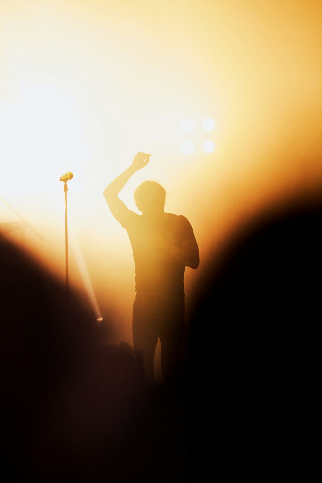 man singing on the stage photograph