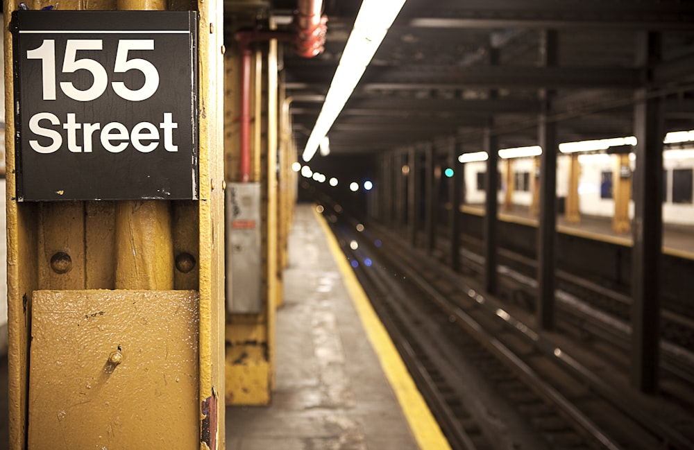 train station with 155 Street signage