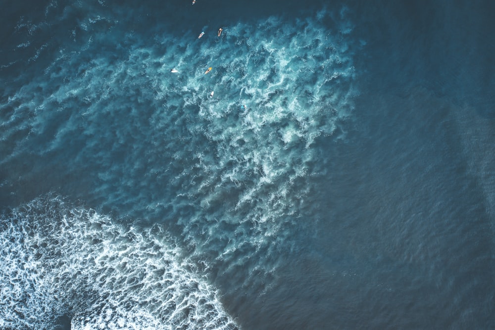aerial photography of waves rippling in the sea