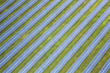 Rows of solar panels stretching across a green field near Erbil.