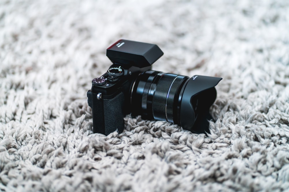 shallow focus photo of black DSLR camera