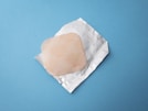 square brown tissue and white paper pack