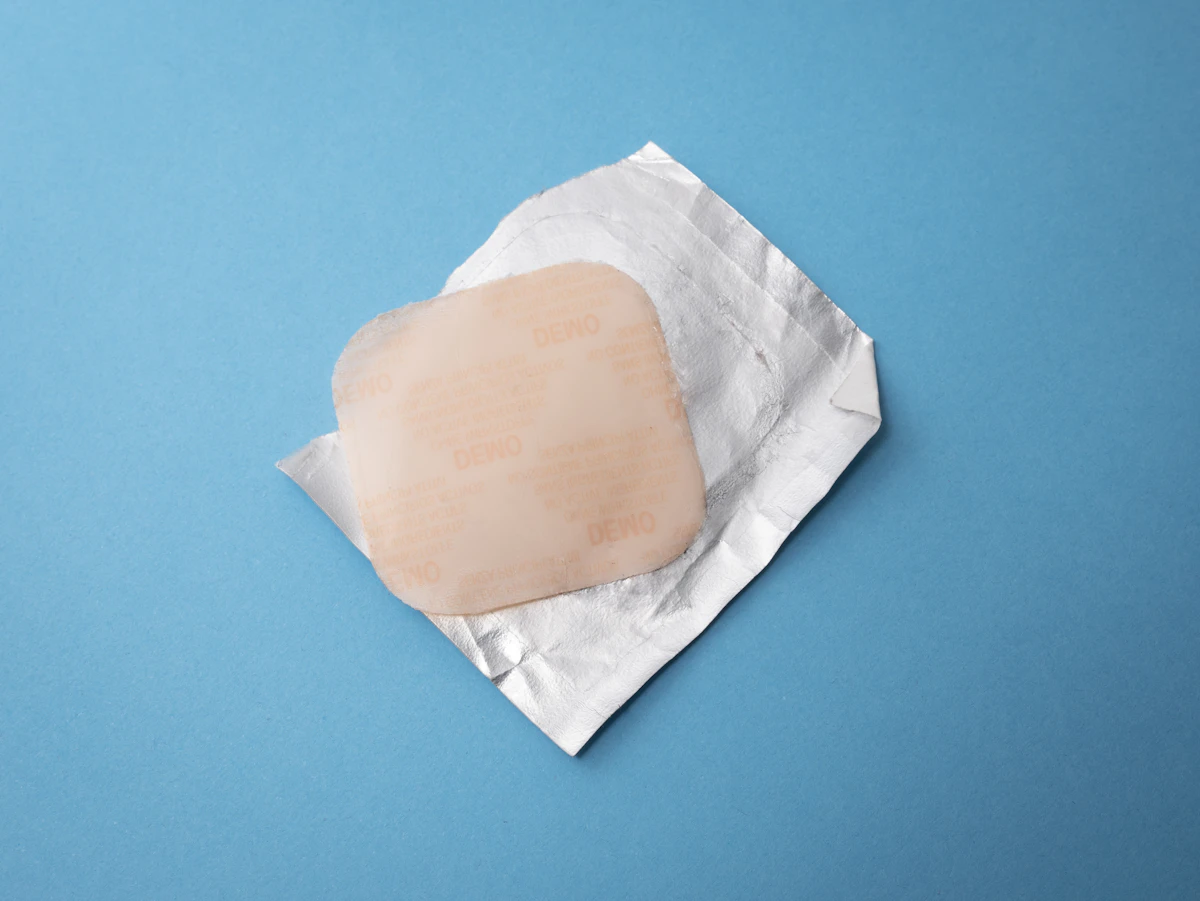 A hormone patch — transdermal HRT delivers oestradiol directly through the skin, bypassing the liver