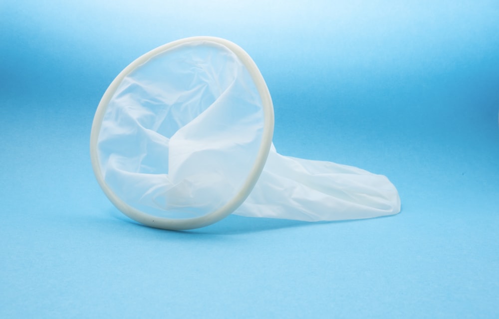 white condom in blue background