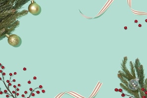 A flat lay of festive jewelry pieces surrounded by seasonal decorations.