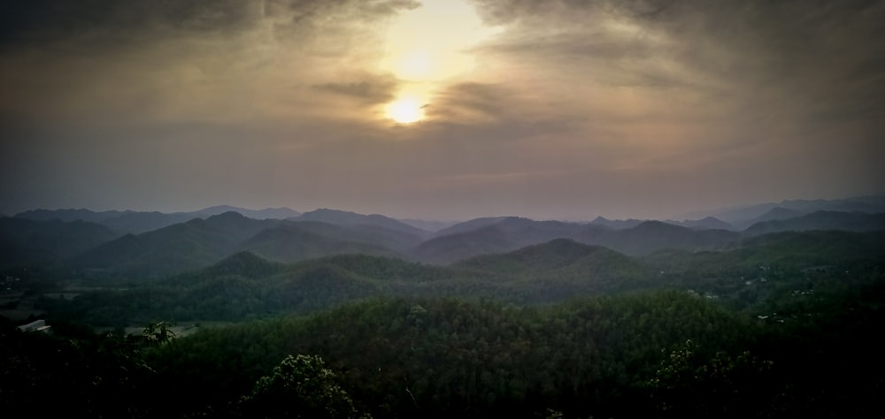 green hills and gray clouds