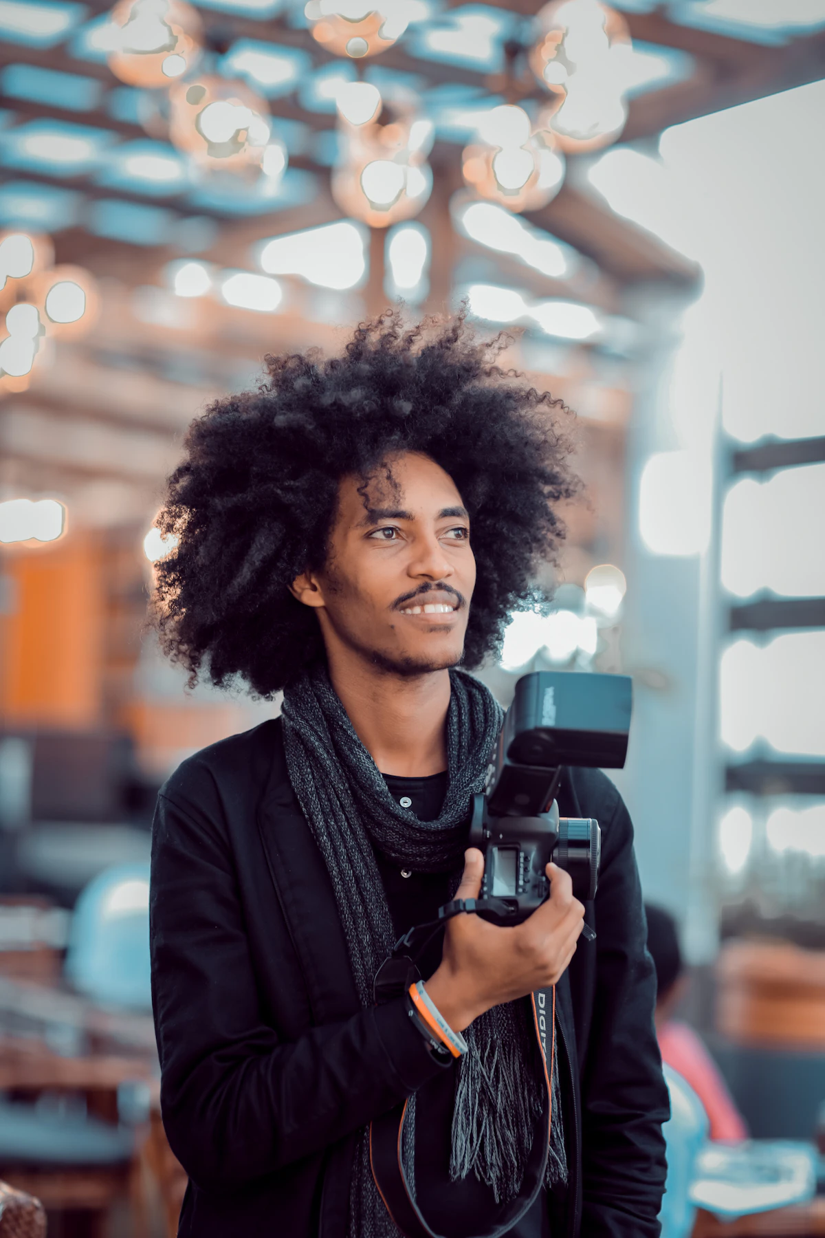 Black content creator with a camera producing digital media