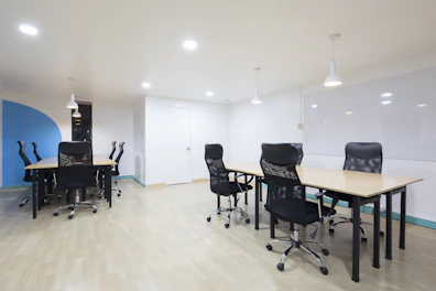 empty two tables and rolling chairs