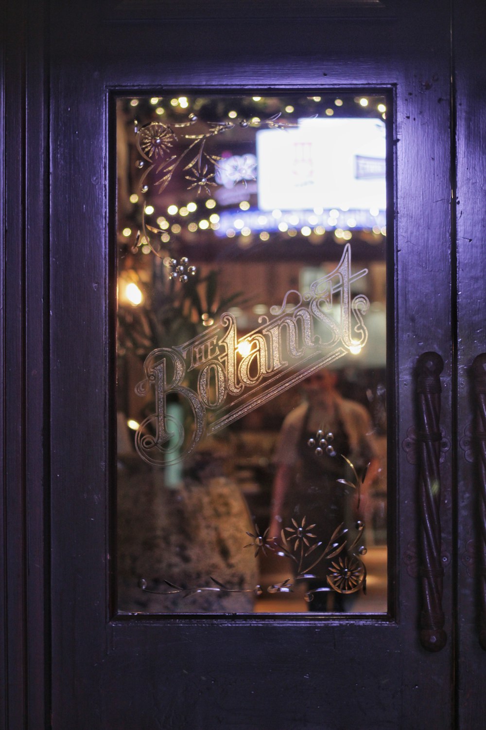 black wooden framed clear glass door