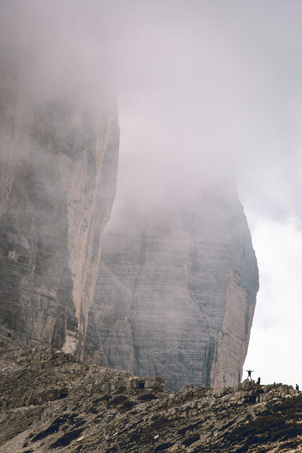 gray cliff under cloudy sky during daytime