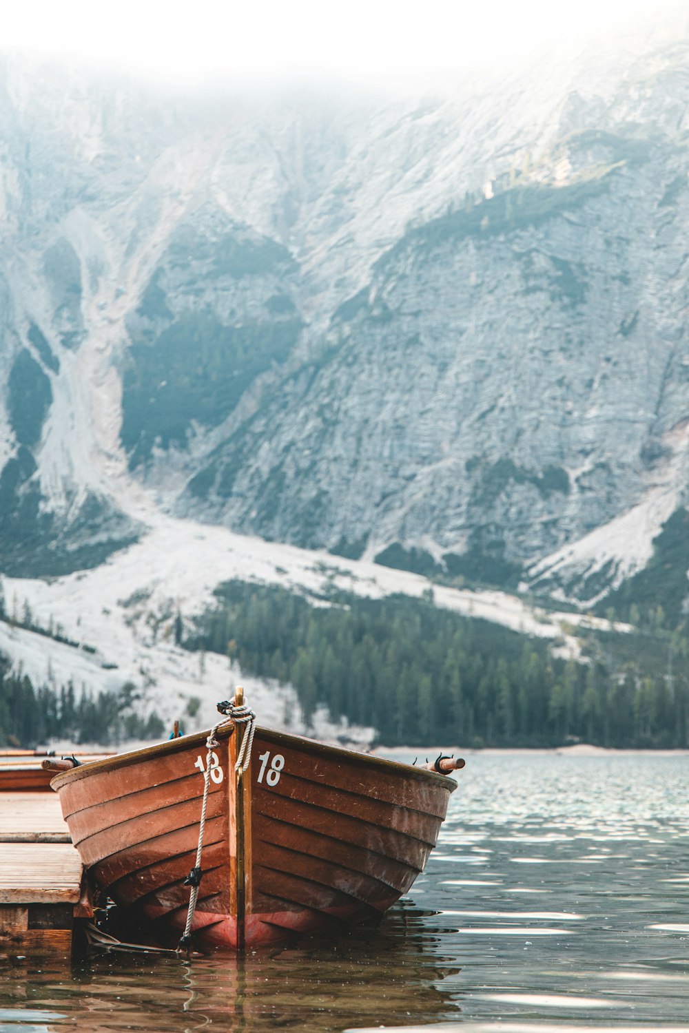 brown wooden boat in a dock