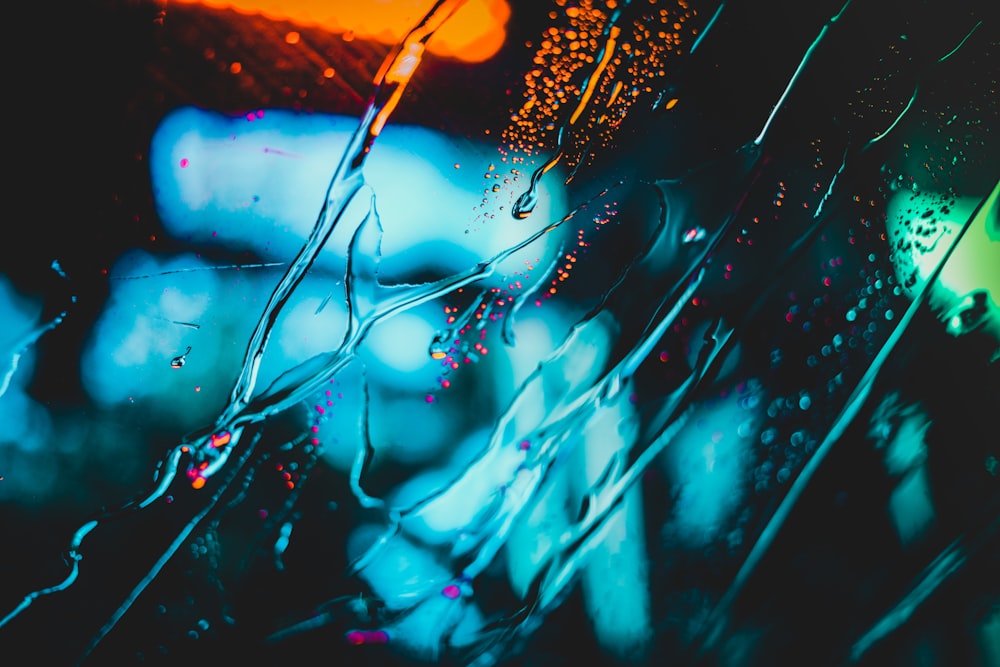 water flowing on clear glass