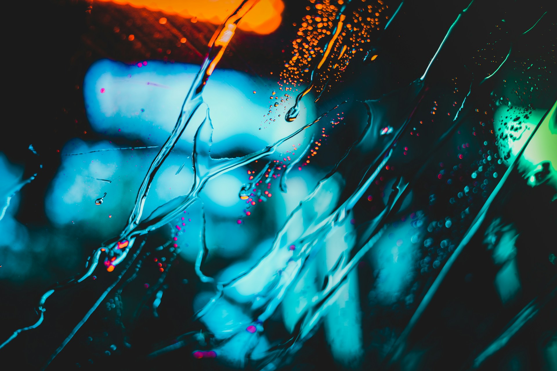 water flowing on clear glass
