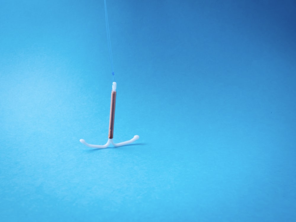 a toothbrush with a toothpick sticking out of it