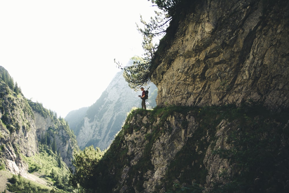 man stands at the cliff