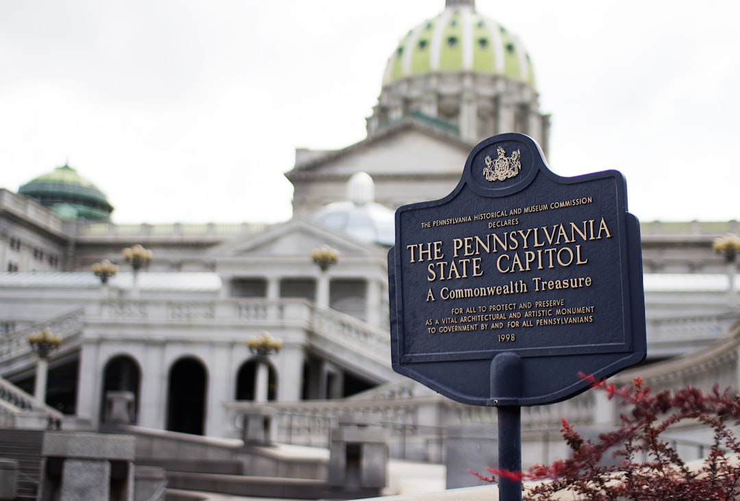 Pennsylvania State Capitol signage wtih capitol building in background