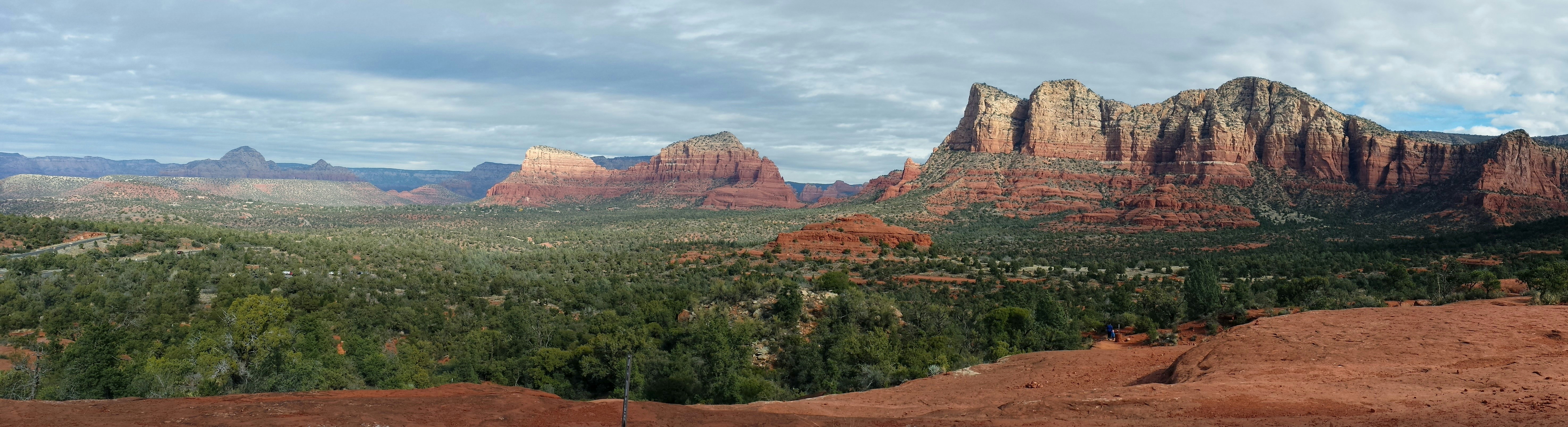 Monument Valley National Park under white and blue sky, 
