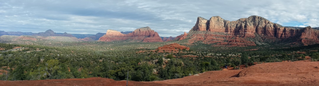 Monument Valley National Park under white and blue sky,