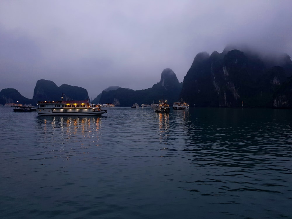 vessel ships floating in body of water during daytime