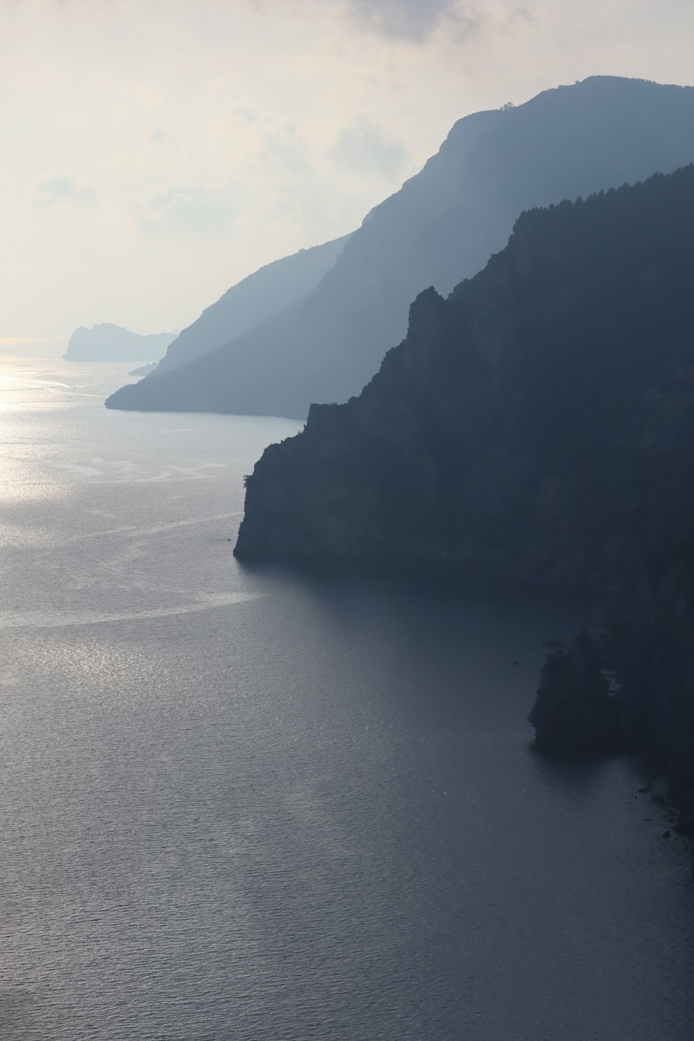 aerial photography of a mountain by the sea