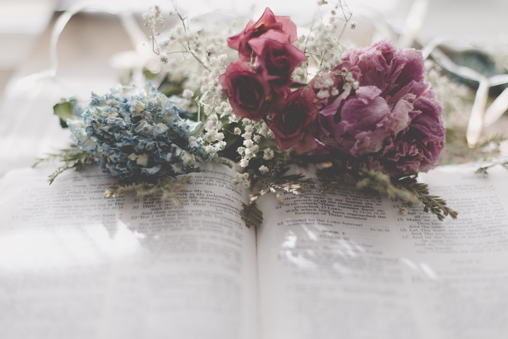 pink bouquet on open book