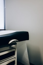 a black and white photo of a hospital bed