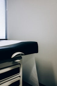 a black and white photo of a hospital bed