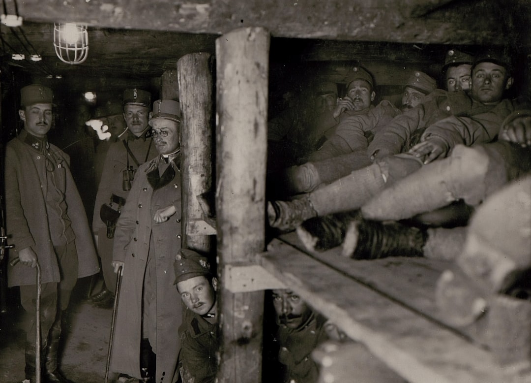 grayscale photography of soldier men inside cave, World War 1. Interior of a company cavern on Calvary; Section Podgora South.