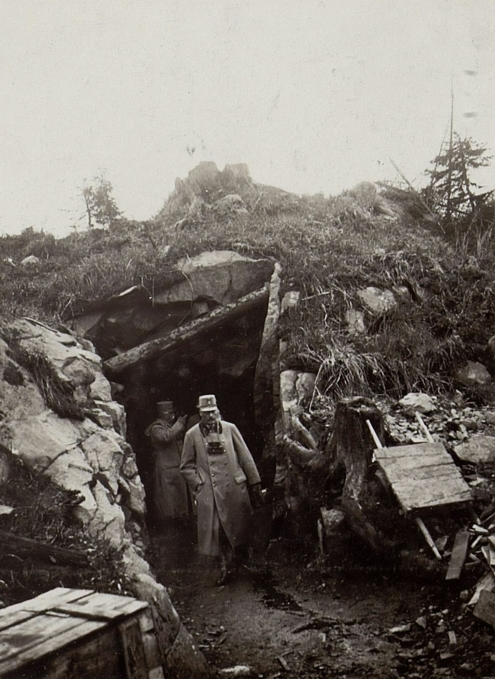 grayscale photography of men coming out of a mining tunnel