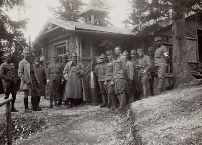 grayscale photography of soldier standing beside house during daytime troops google meet background