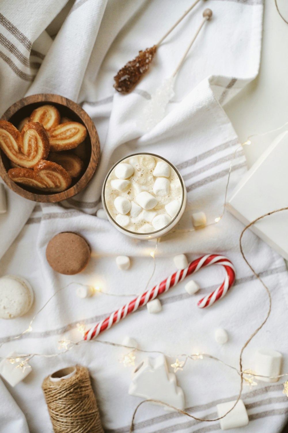 sliced bread, marshmallows, candycane, macaroons, and brown thread spool