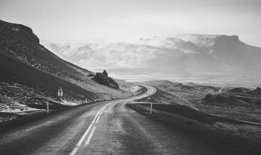 grayscale photography of road viewing mountain