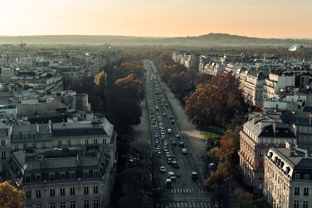 aerial photography of different vehicles viewing city with high-rise buildings during daytime