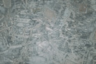 Abstract map pattern with Eurasian connection lines glowing subtly on a deep navy background.