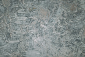 Abstract map pattern with Eurasian connection lines glowing subtly on a deep navy background.