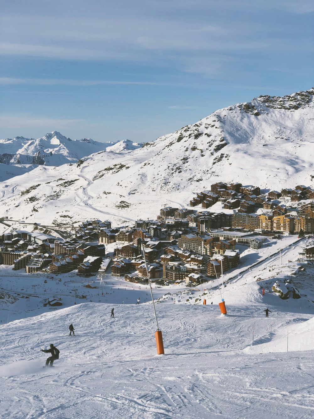 photography of brown buildings and mountain range during daytime