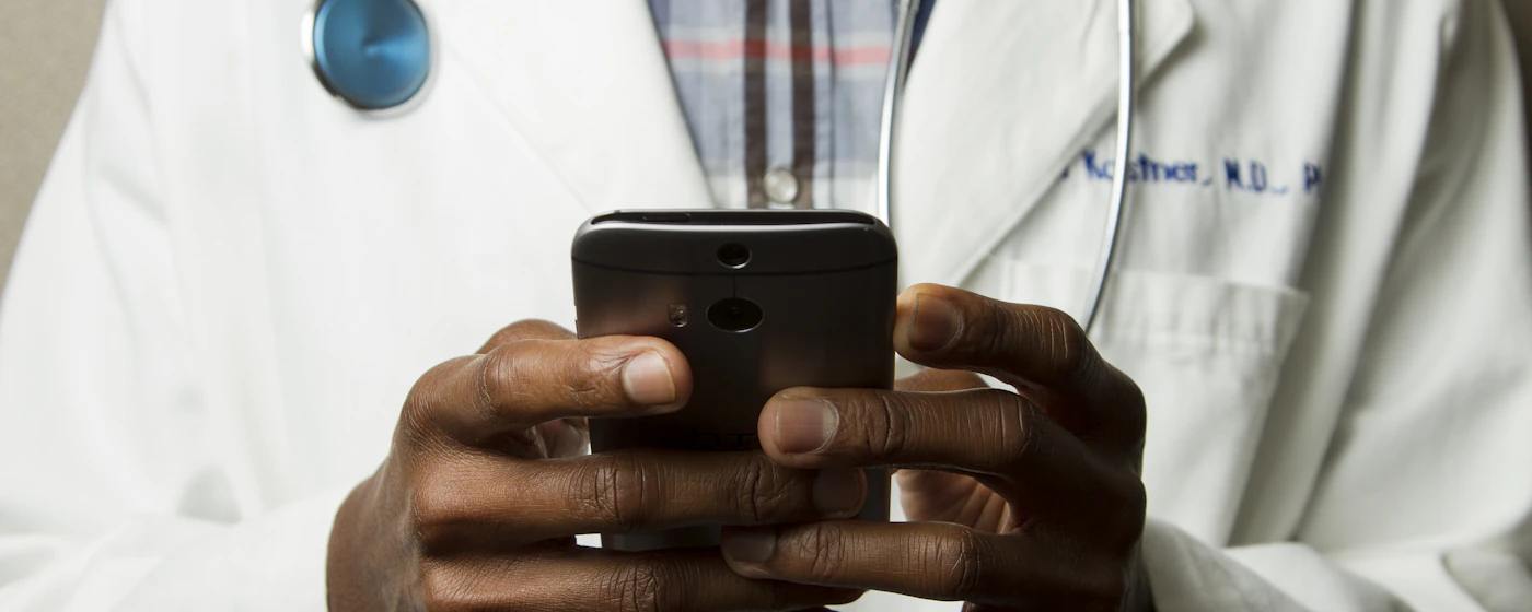 Physician with patient in connected clinical setting