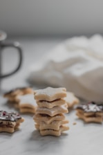 A close-up shot of Kayani Bakery's Shrewsberry cookies stacked neatly on a rustic wooden table.