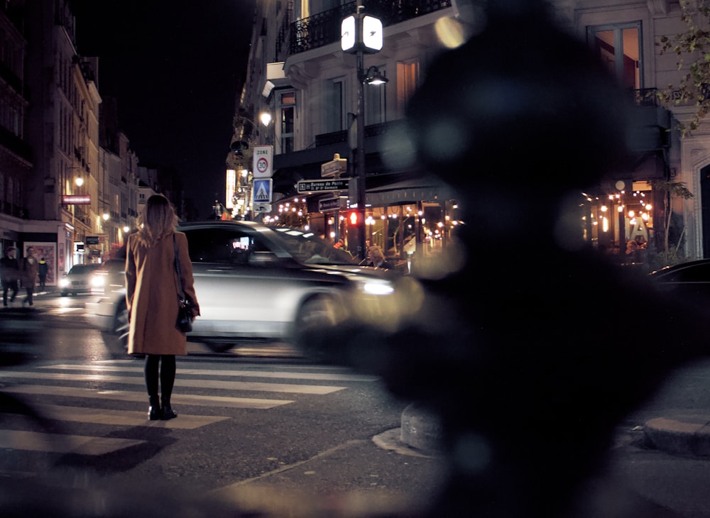 selective focus photography of woman beside street