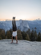 man hand standing on cliff