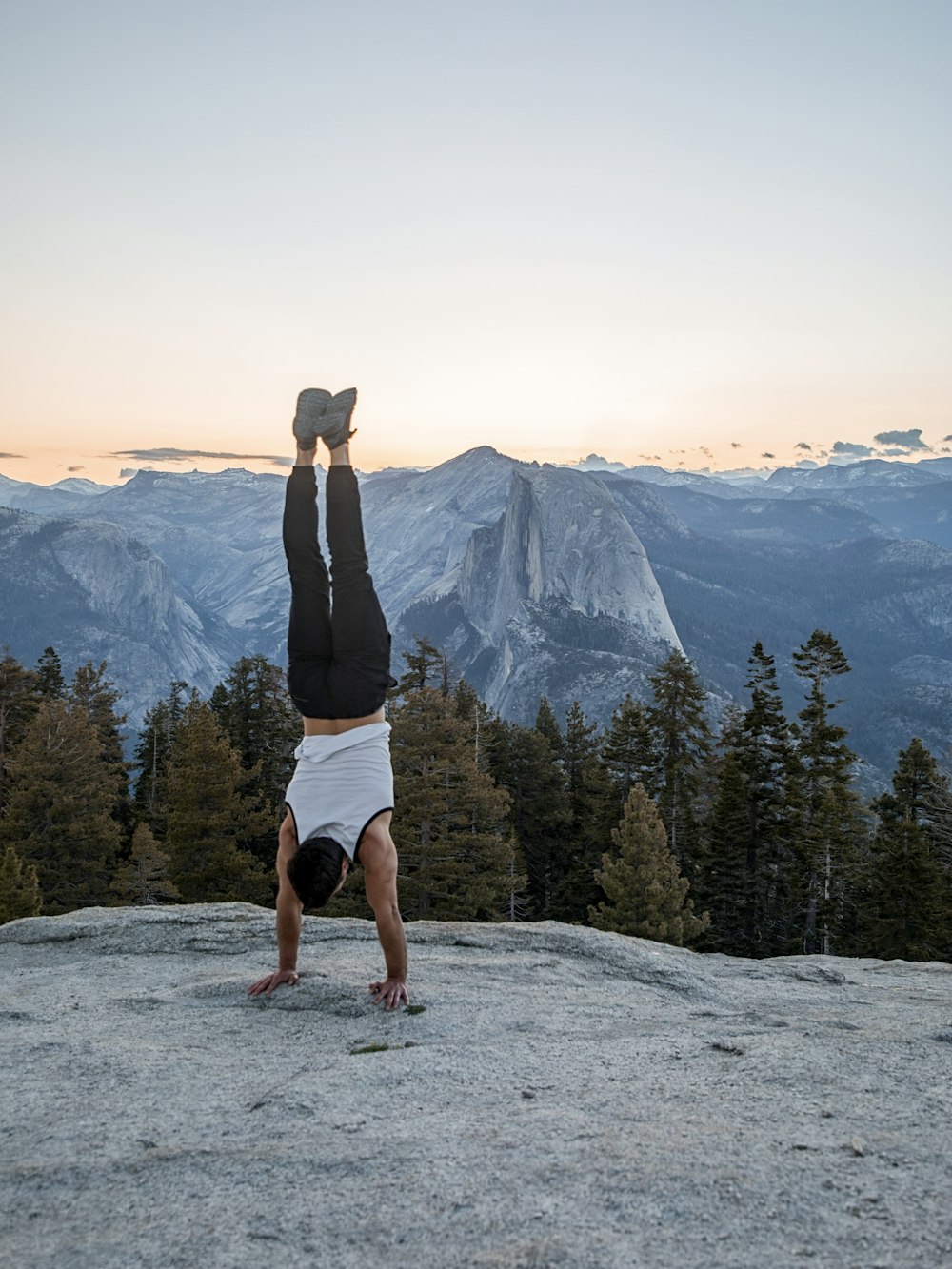 man hand standing on cliff