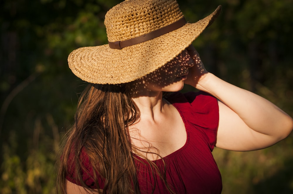 selective focus photography of woman wearing sun hat