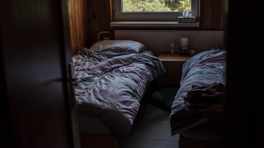 grey bedspreads inside room