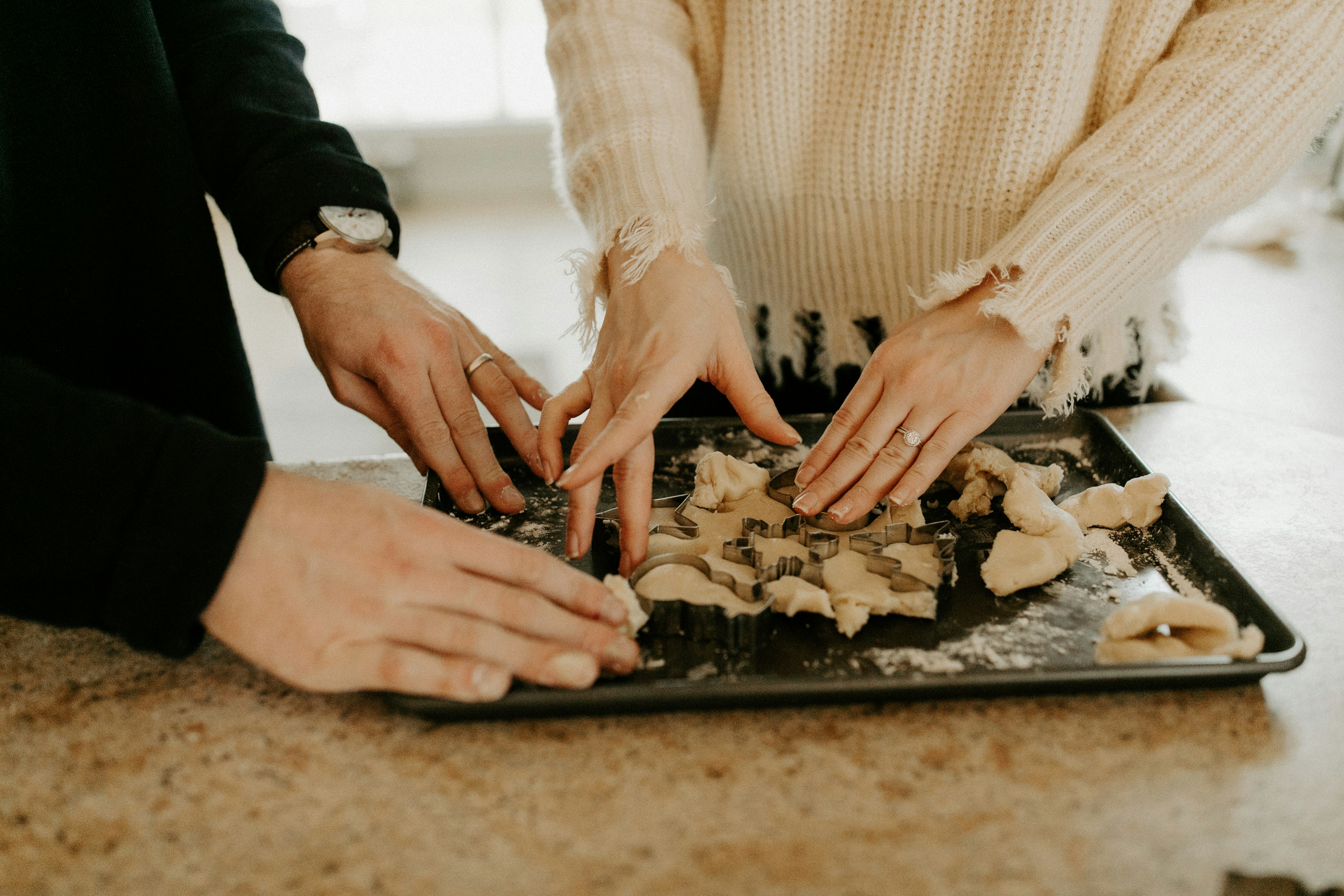 couple hands baking christmas holiday cookies