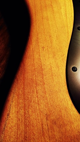 A close-up of a stylish product displayed on a wooden table with natural lighting.