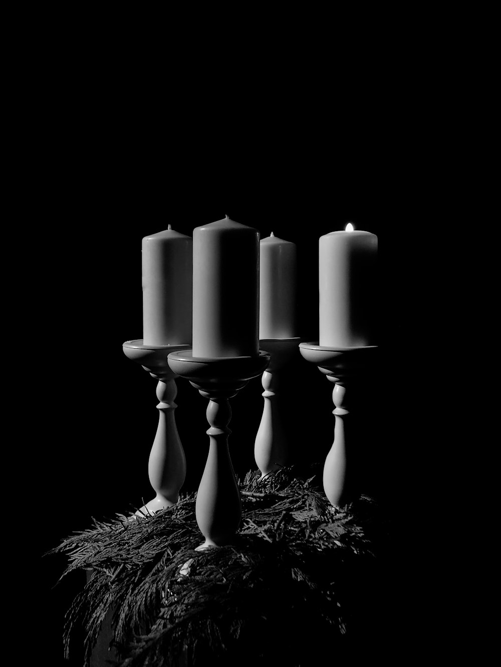 grayscale photography of unlighted candle