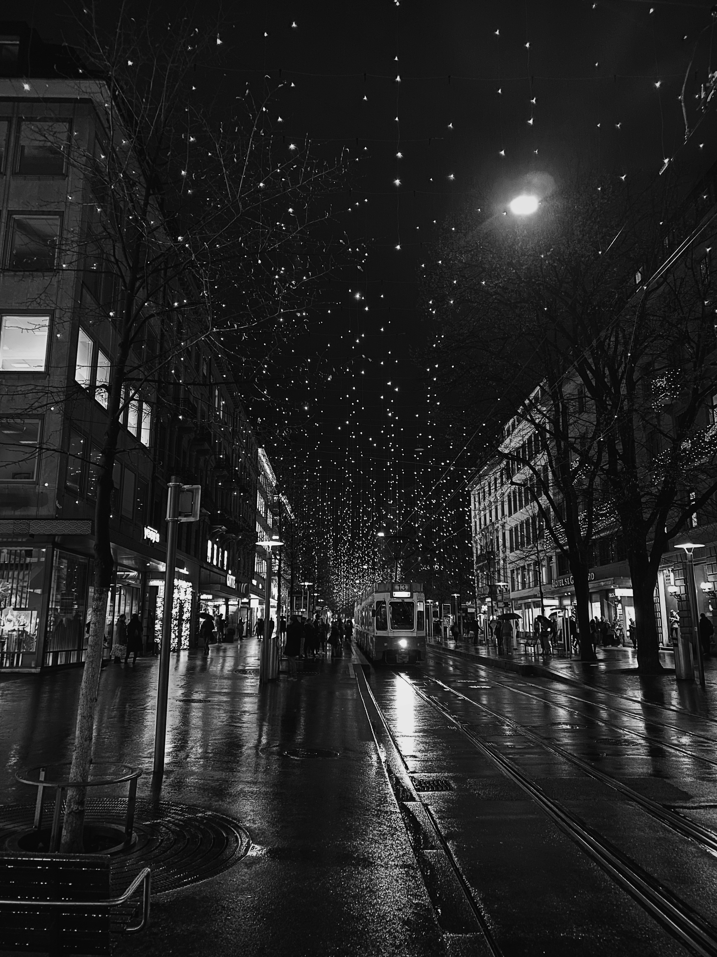 grayscale photography of tram at night