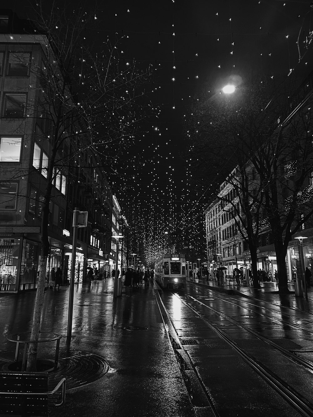 grayscale photography of tram at night