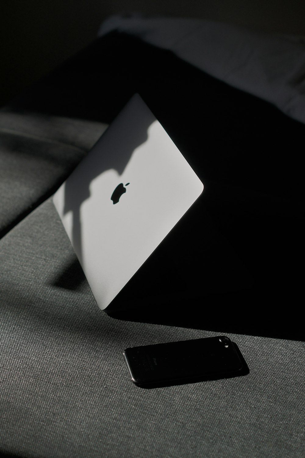 iPhone beside MacBook